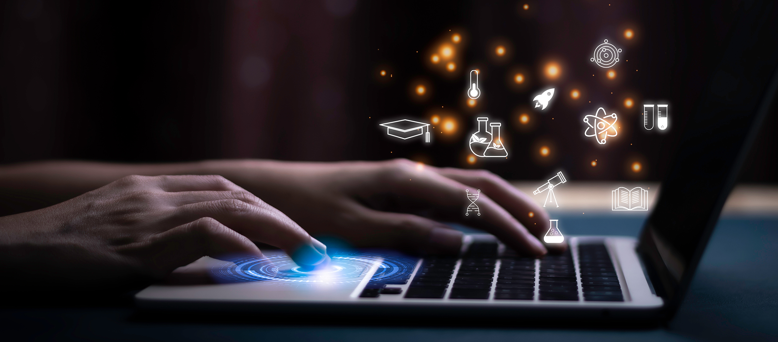 Image of a person working on a laptop surrounded by science icons.